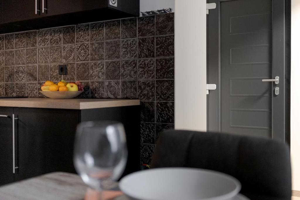 Kuchyňa alebo kuchynka v ubytovaní Apartman DOWNTOWN DL