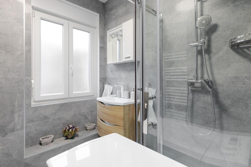 Kúpeľňa v ubytovaní Apartman DOWNTOWN DL