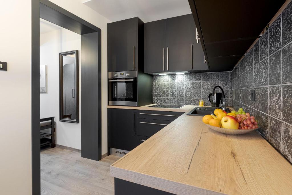 Kuchyňa alebo kuchynka v ubytovaní Apartman DOWNTOWN DL