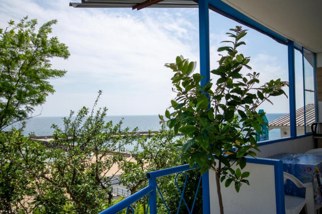 a view of the ocean from the balcony of a house at Ваканционни къщи'На брега' Holiday houses ON THE COAST in Varna City
