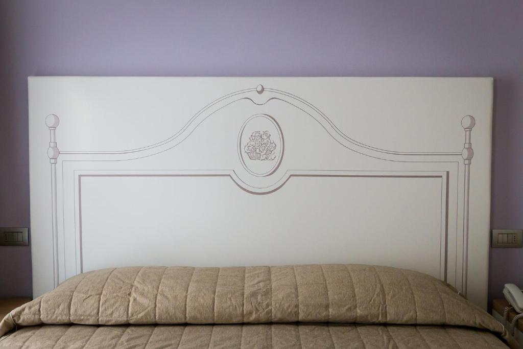 Postel nebo postele na pokoji v ubytování Hotel Monteverde