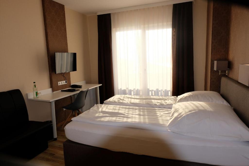 Postel nebo postele na pokoji v ubytování Zum Weissen Lamm