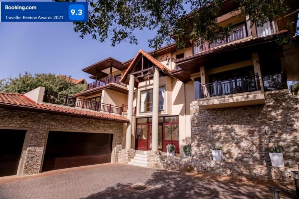 an image of a house with a driveway at 7 Yellow Wood Drive, Zimbali Coastal Estate in Ballito