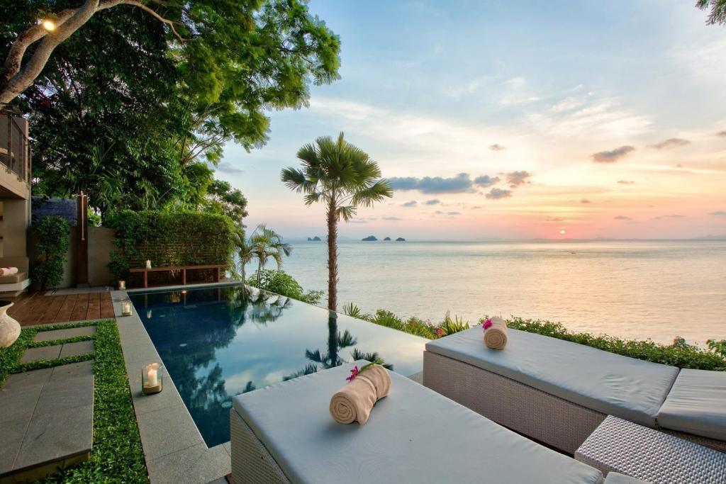 a swimming pool with a view of the ocean at The Headland Villa 2, Samui in Koh Samui