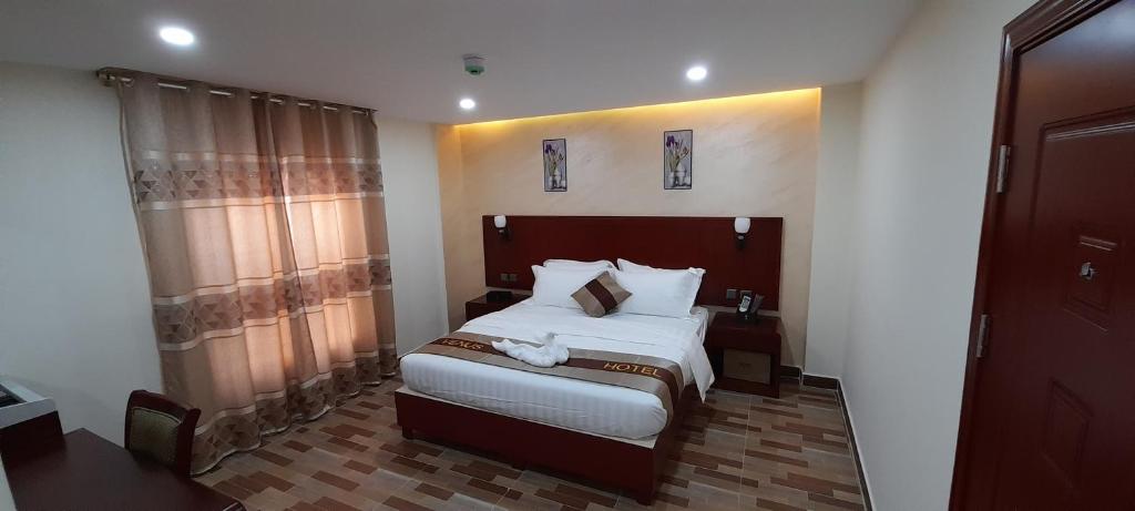 Postel nebo postele na pokoji v ubytování Venus Hotel