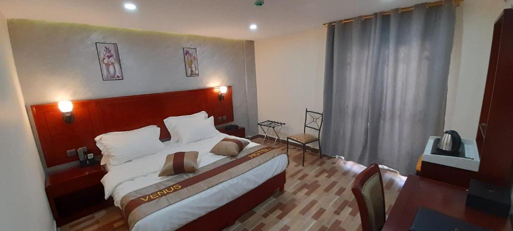 Postel nebo postele na pokoji v ubytování Venus Hotel