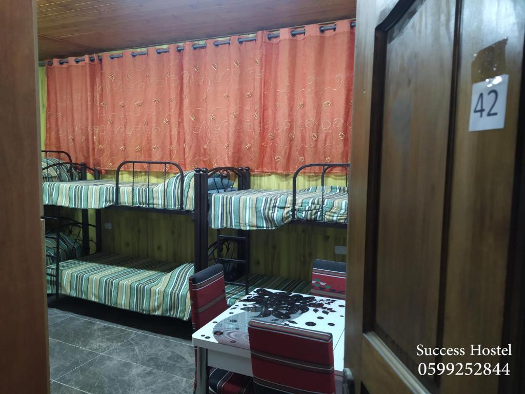 Postel nebo postele na pokoji v ubytování Success Hostel