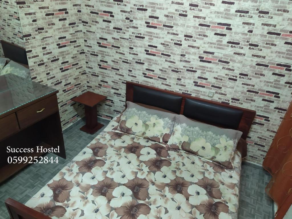 Postel nebo postele na pokoji v ubytování Success Hostel