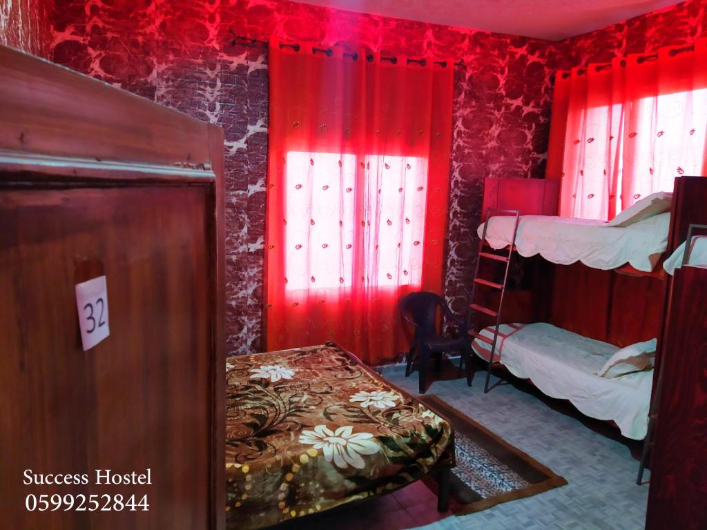 Postel nebo postele na pokoji v ubytování Success Hostel