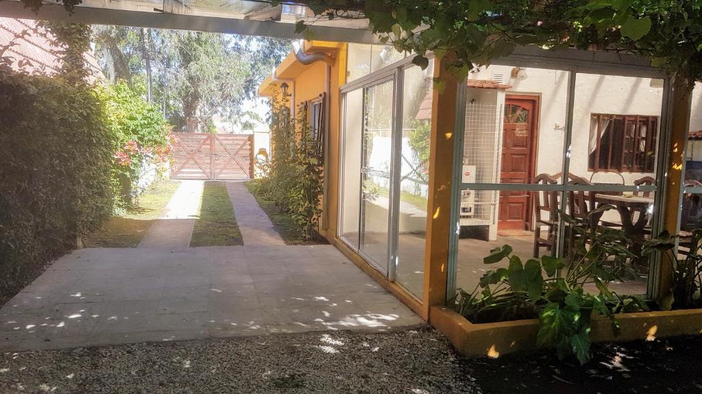 an entrance to a house with a glass door at Cabañas La Polaca 1 in Santa Clara del Mar