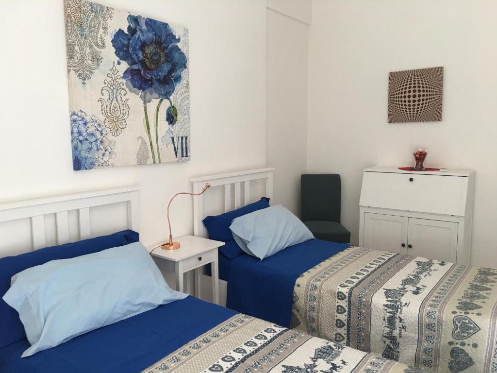 Postel nebo postele na pokoji v ubytování Hibiscus