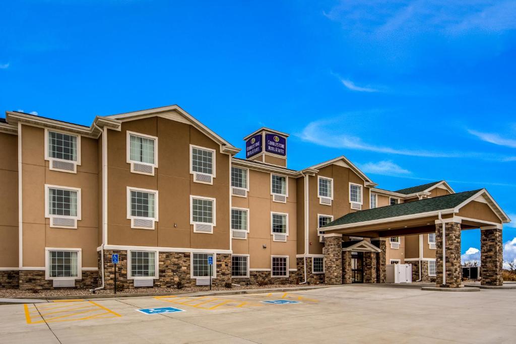 a rendering of a hotel with a building at Cobblestone Hotel & Suites - Cozad in Cozad