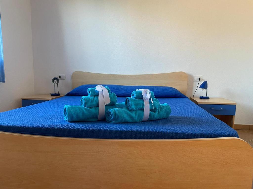 Łóżko lub łóżka w pokoju w obiekcie Case Vacanze Sole e Luna