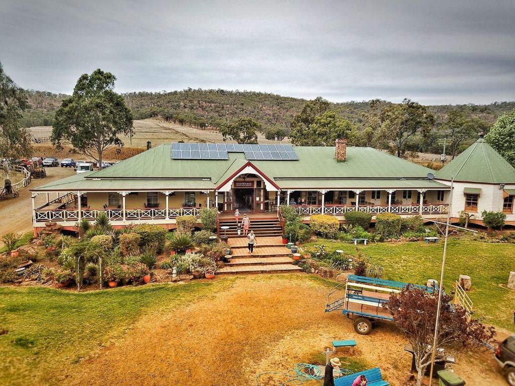 an aerial view of a house with solar panels on it at Bestbrook Mountain Farmstay in Maryvale