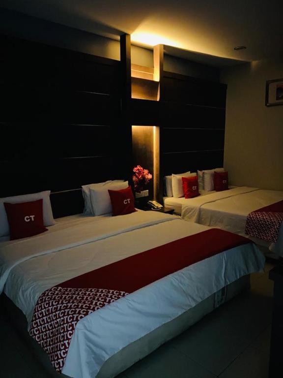 Postel nebo postele na pokoji v ubytování Ct Hotel