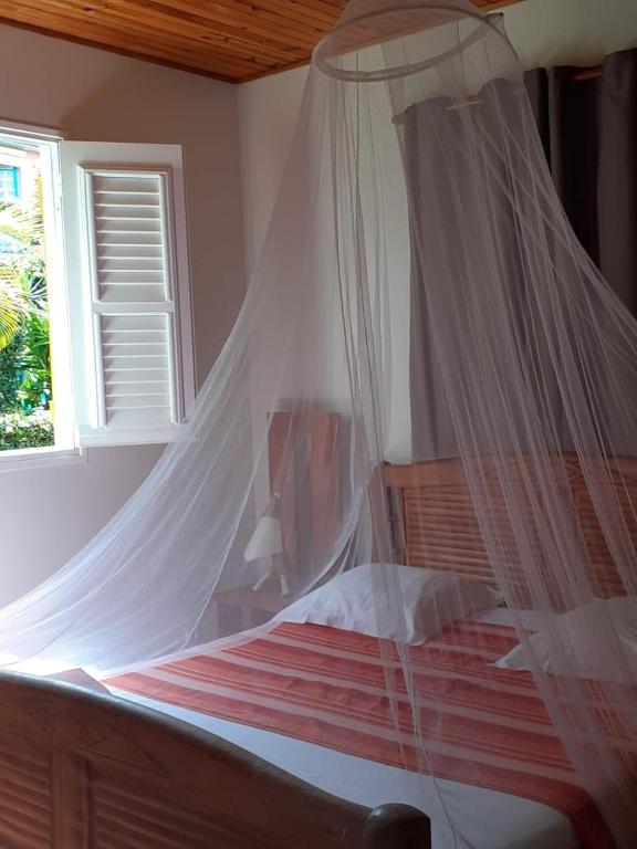 Postel nebo postele na pokoji v ubytování RESIDENCE LA TAUPINE MANDARINE