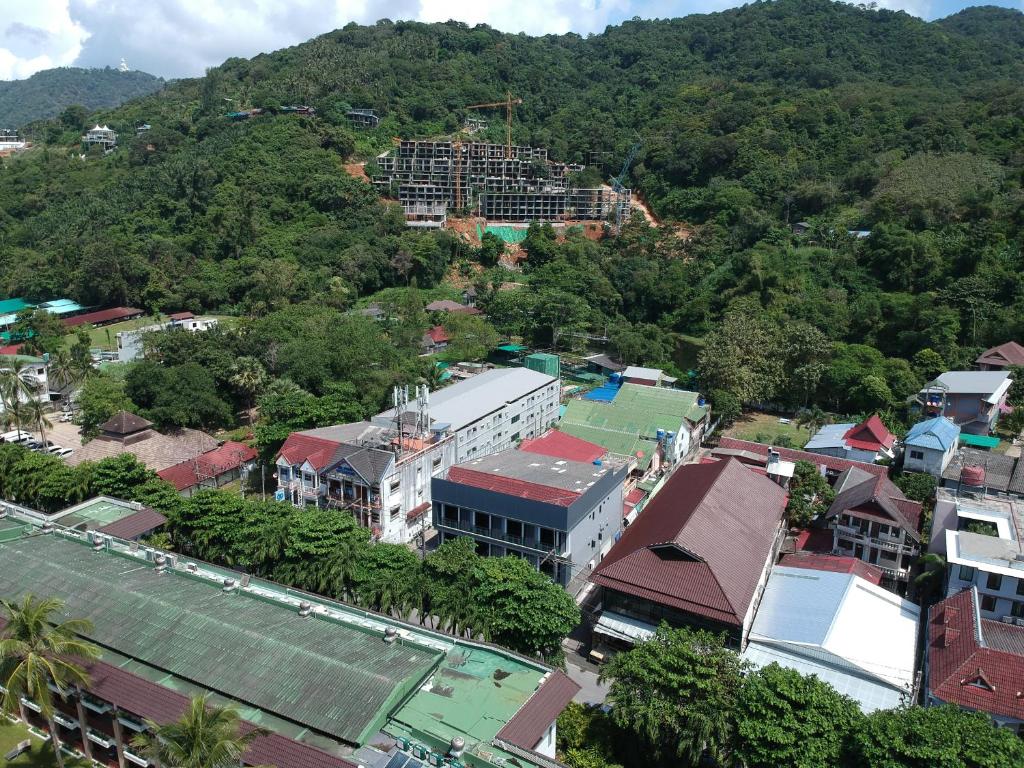 an aerial view of a city with a mountain at The Mantra Hotel Kata Noi in Kata Beach