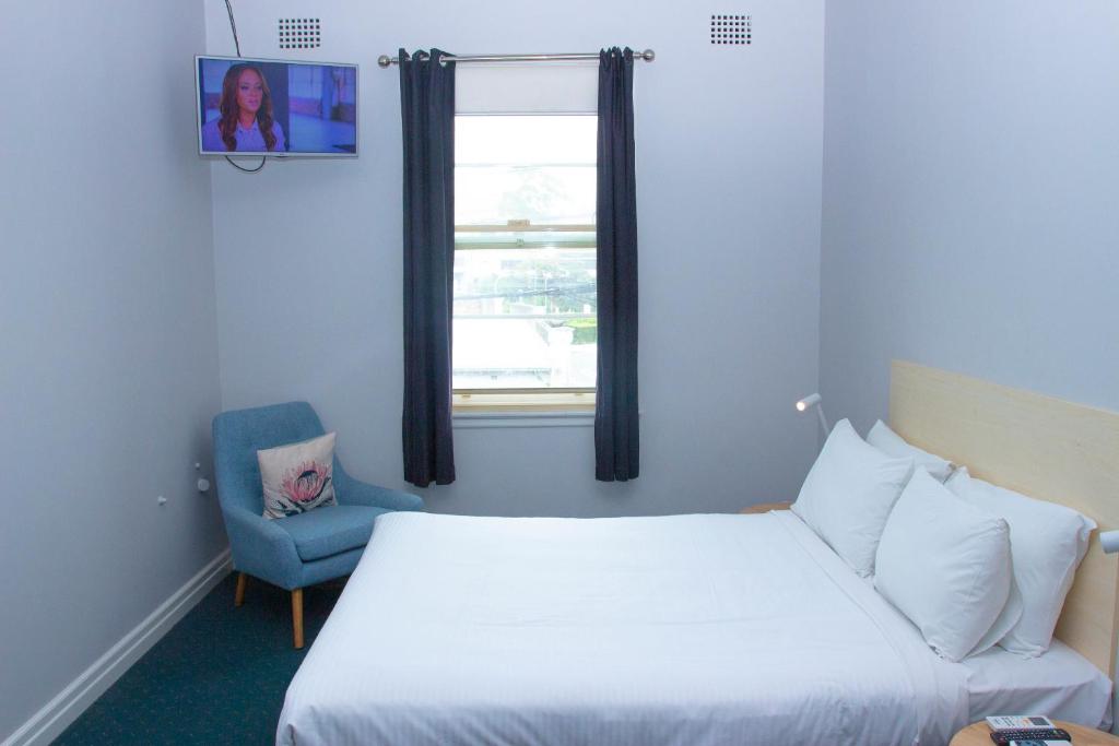 Postel nebo postele na pokoji v ubytování Grand Hotel Rockdale