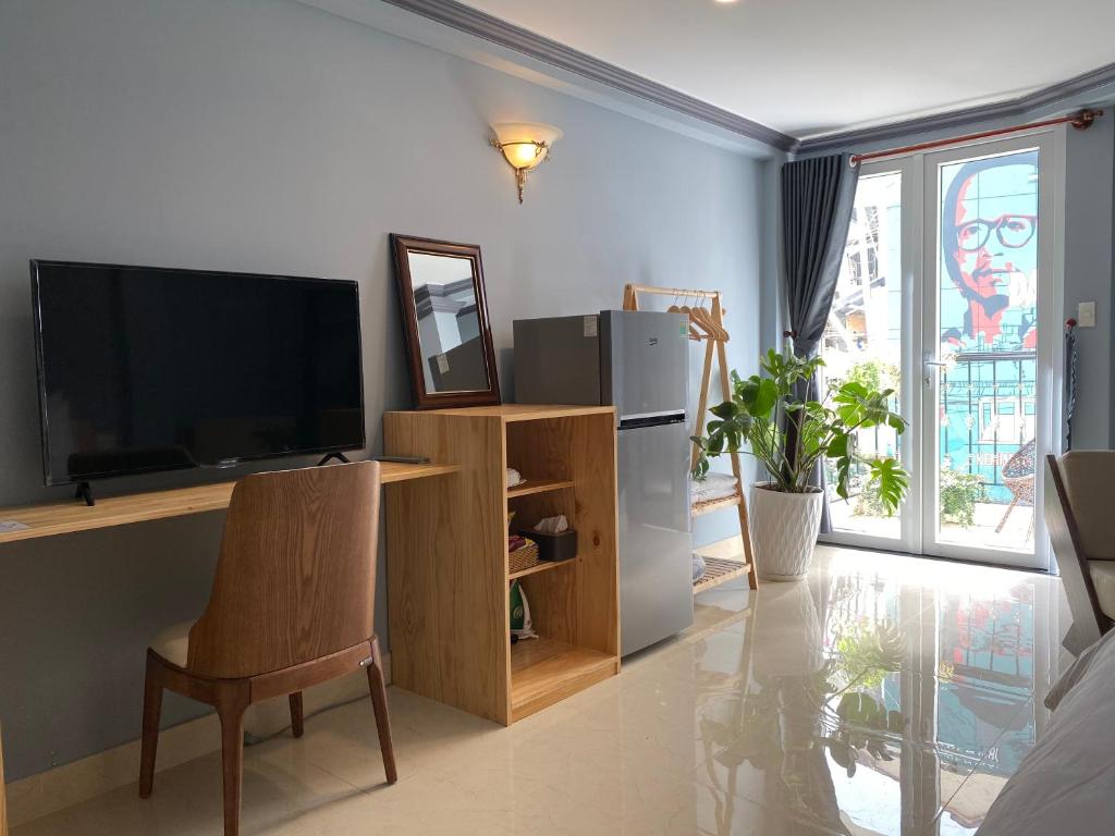 TV/trung tâm giải trí tại CozyNook Boutique Apartments - 3 thang 2 Street