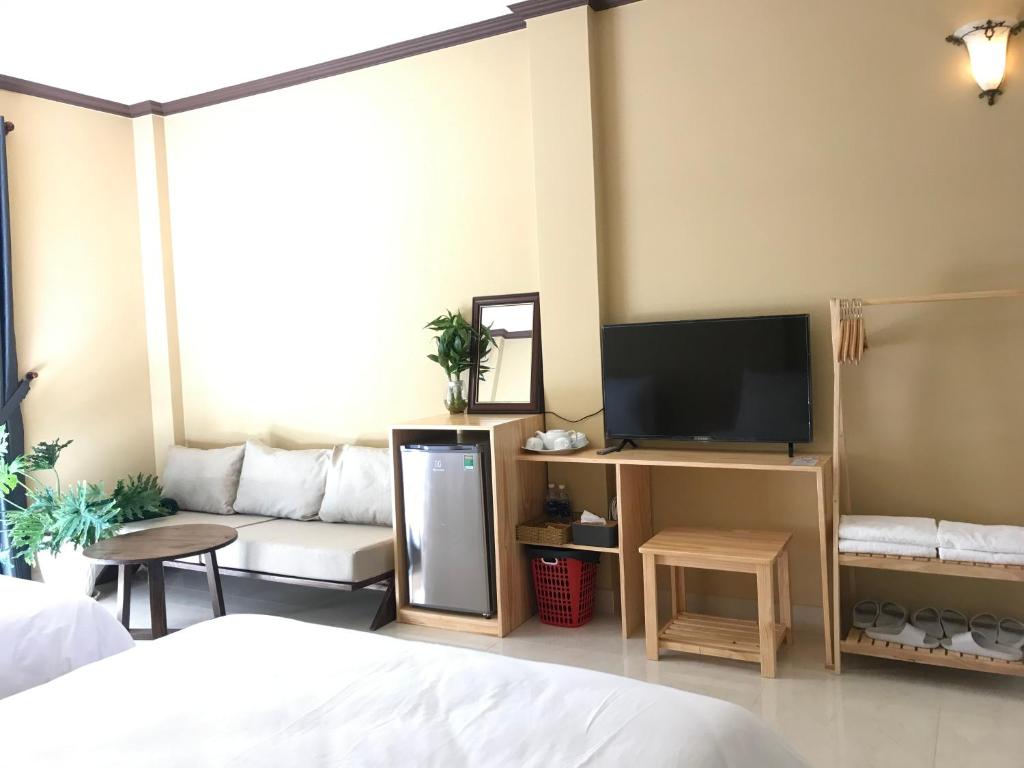 TV/trung tâm giải trí tại CozyNook Boutique Apartments - 3 thang 2 Street
