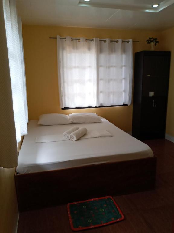 Postel nebo postele na pokoji v ubytování Vievan's transient house