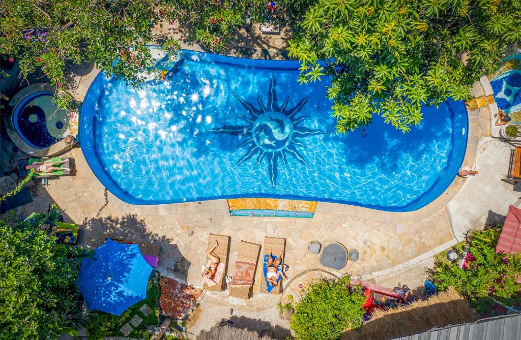 an overhead view of a swimming pool in a theme park at Serenity Eco Guesthouse - CHSE certified in Canggu