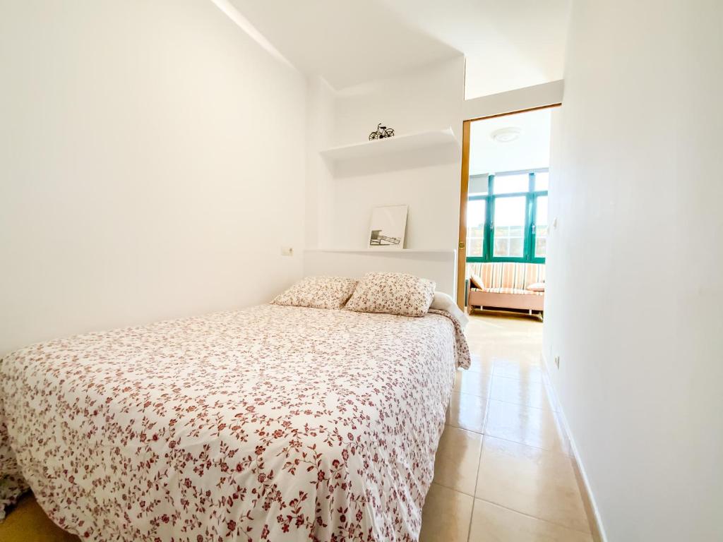 A bed or beds in a room at Apartamentos Sapoconcho by ALÔGA