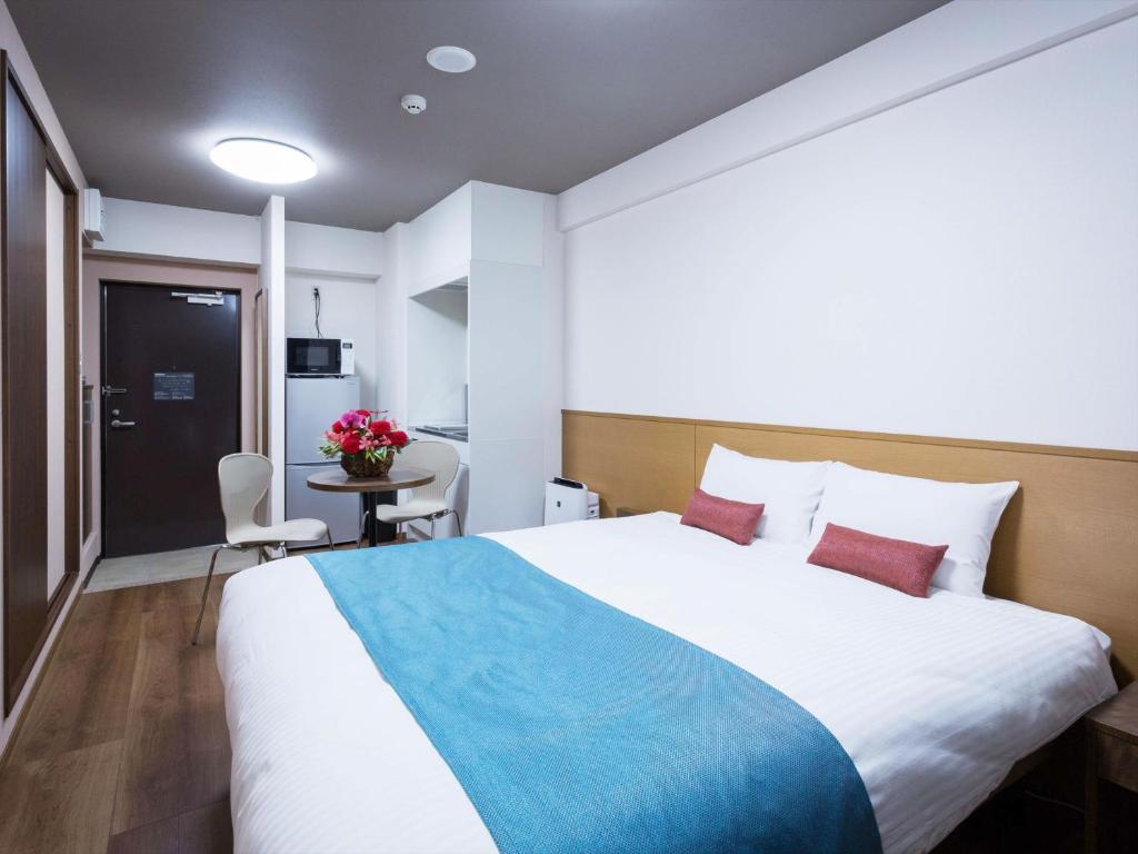 Postel nebo postele na pokoji v ubytování Ryujin Hotel Ukishima