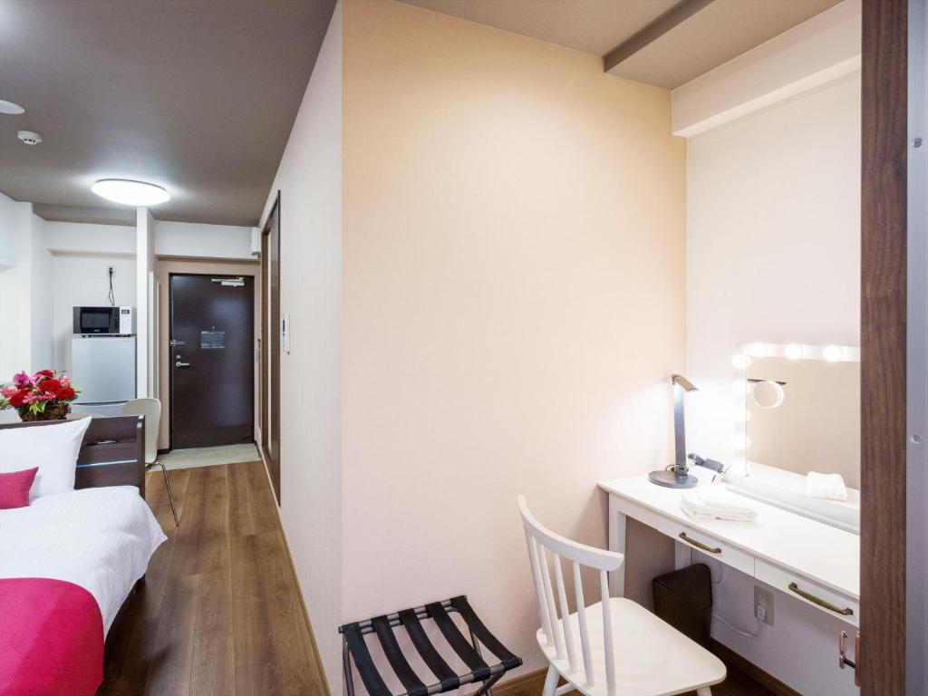 Postel nebo postele na pokoji v ubytování Ryujin Hotel Ukishima