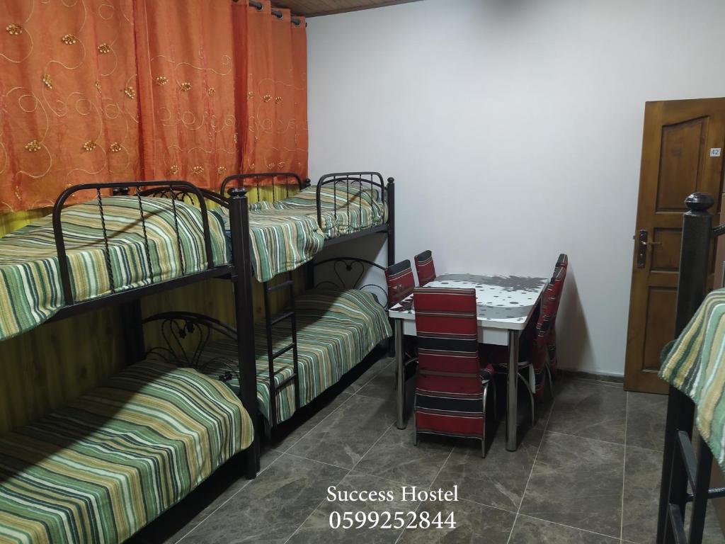 Postel nebo postele na pokoji v ubytování Success Hostel