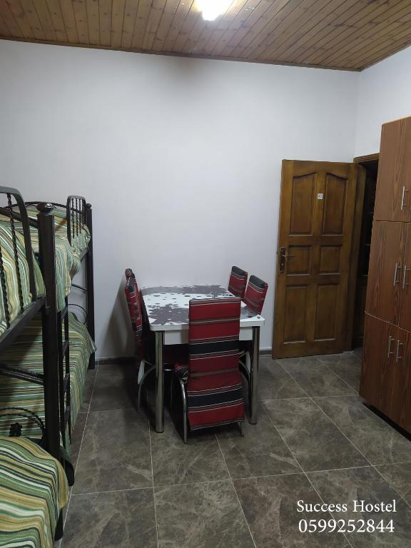 Postel nebo postele na pokoji v ubytování Success Hostel