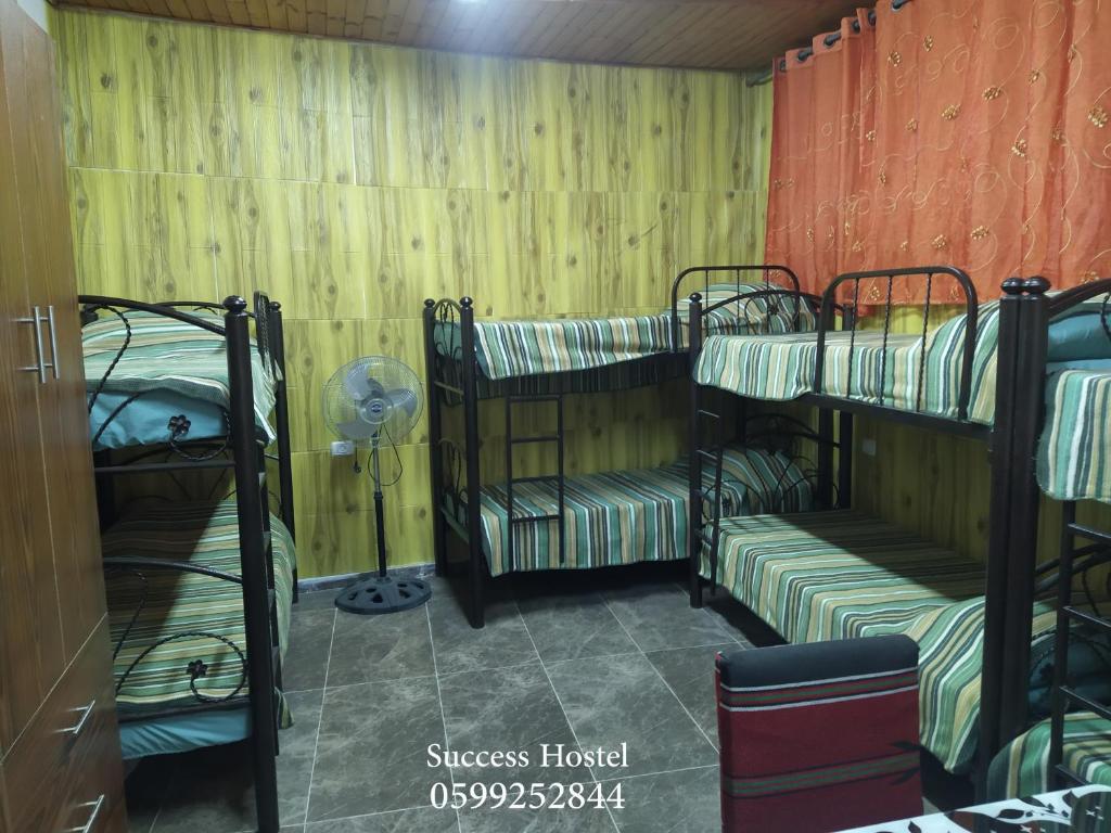 Postel nebo postele na pokoji v ubytování Success Hostel
