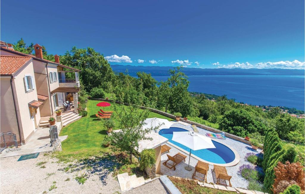 an aerial view of a villa with a swimming pool at Nice Home In Lovran With Sauna in Lovran