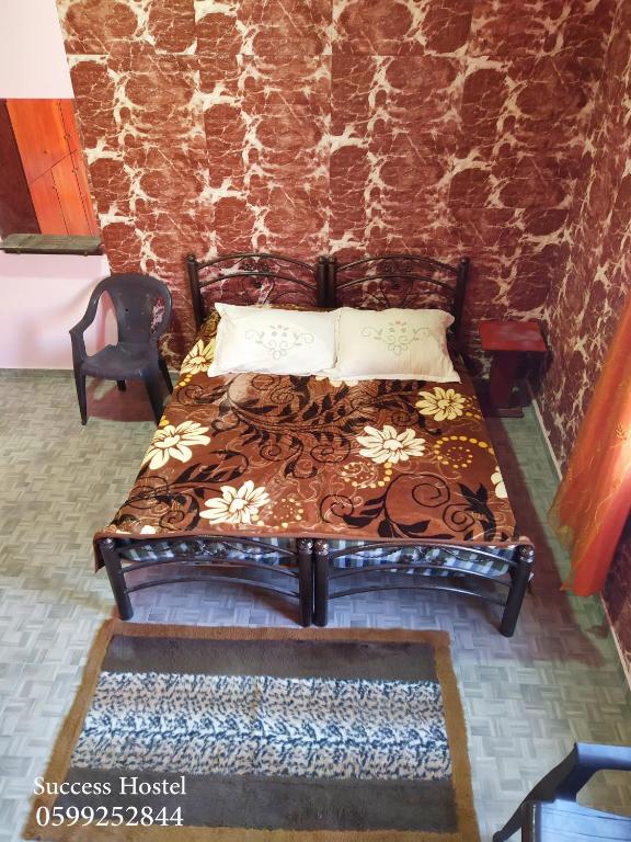 Postel nebo postele na pokoji v ubytování Success Hostel