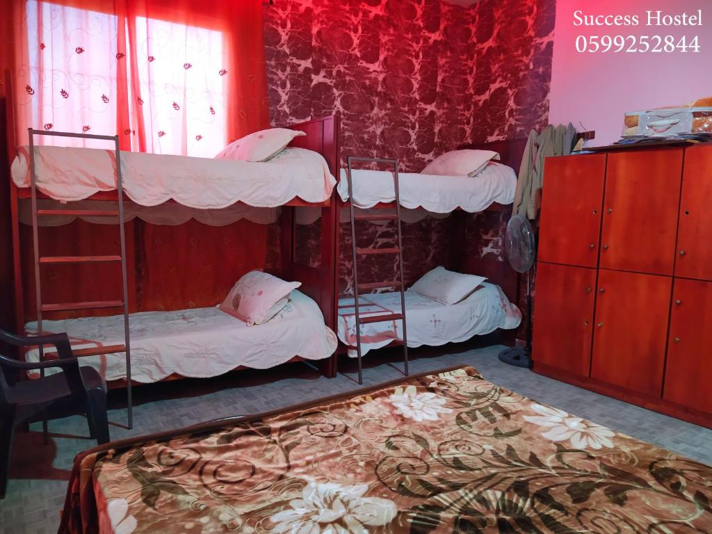 Postel nebo postele na pokoji v ubytování Success Hostel