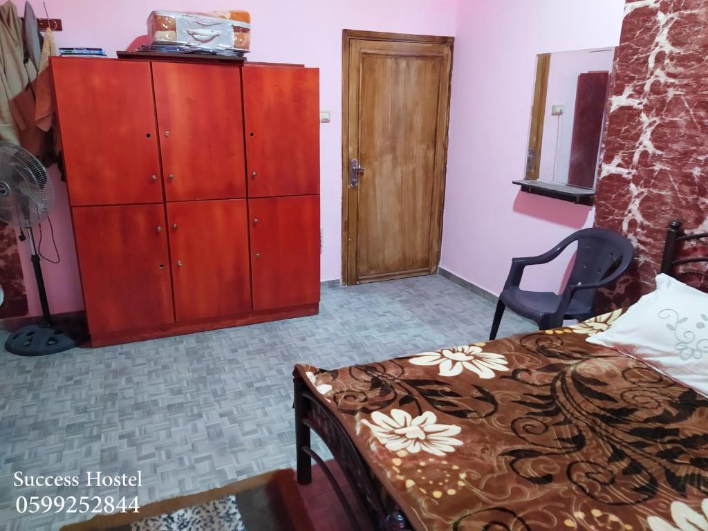 Postel nebo postele na pokoji v ubytování Success Hostel
