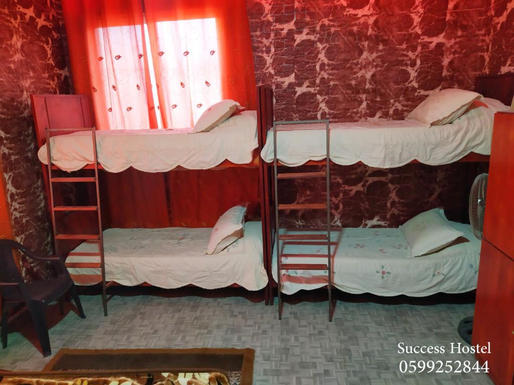 Postel nebo postele na pokoji v ubytování Success Hostel