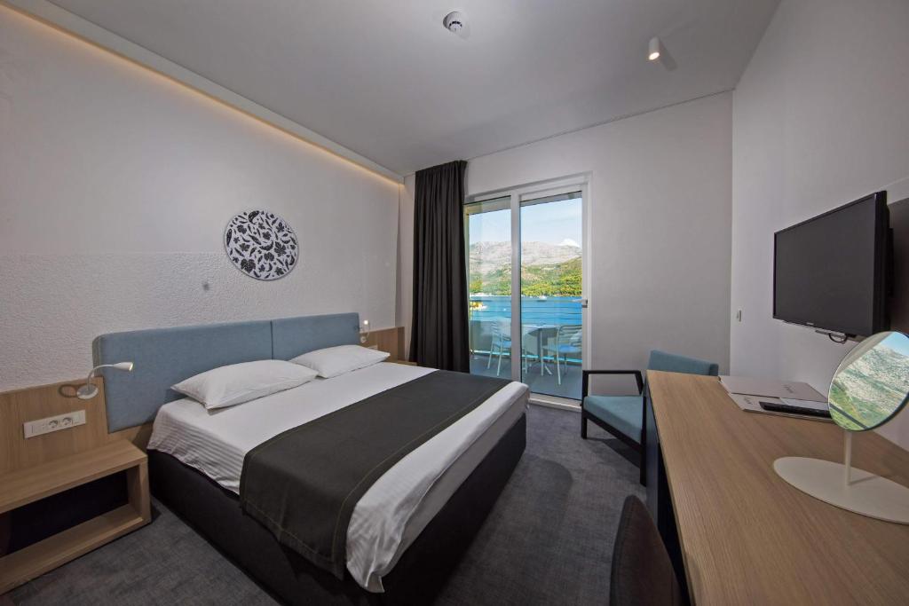 Postel nebo postele na pokoji v ubytování Hotel Osmine