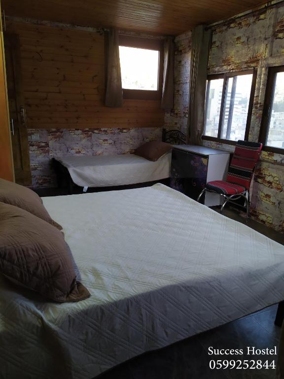Postel nebo postele na pokoji v ubytování Success Hostel
