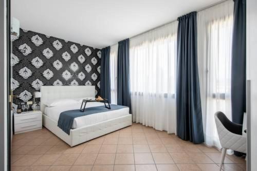 Postel nebo postele na pokoji v ubytování Lake Como Golf Hotel