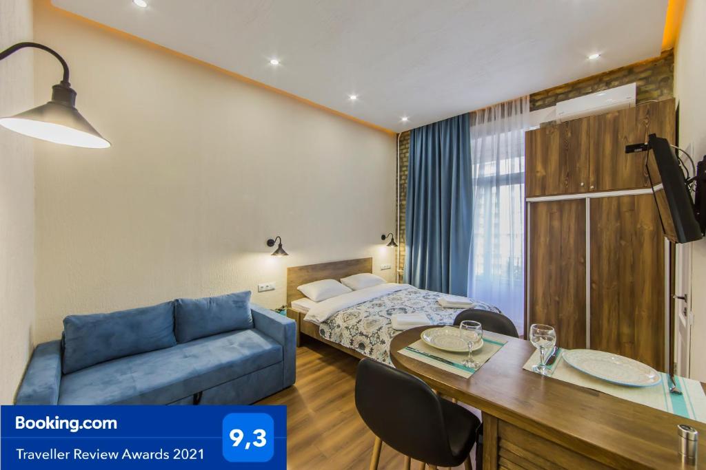 Ένα ή περισσότερα κρεβάτια σε δωμάτιο στο Kyiv Family Loft