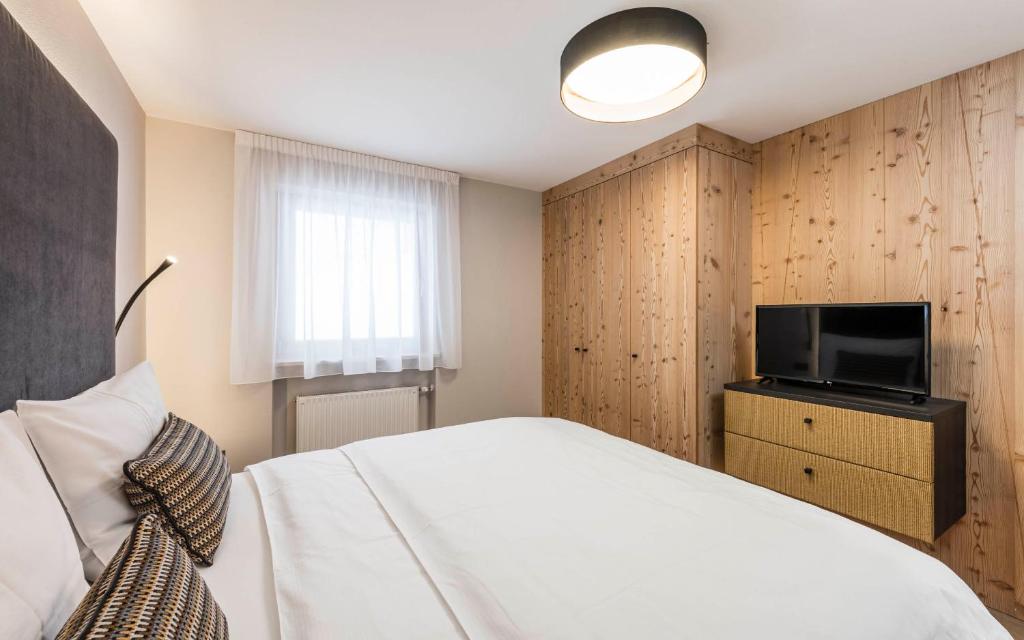 Telewizja i/lub zestaw kina domowego w obiekcie LaMonte Premium Apartments by Feuerstein