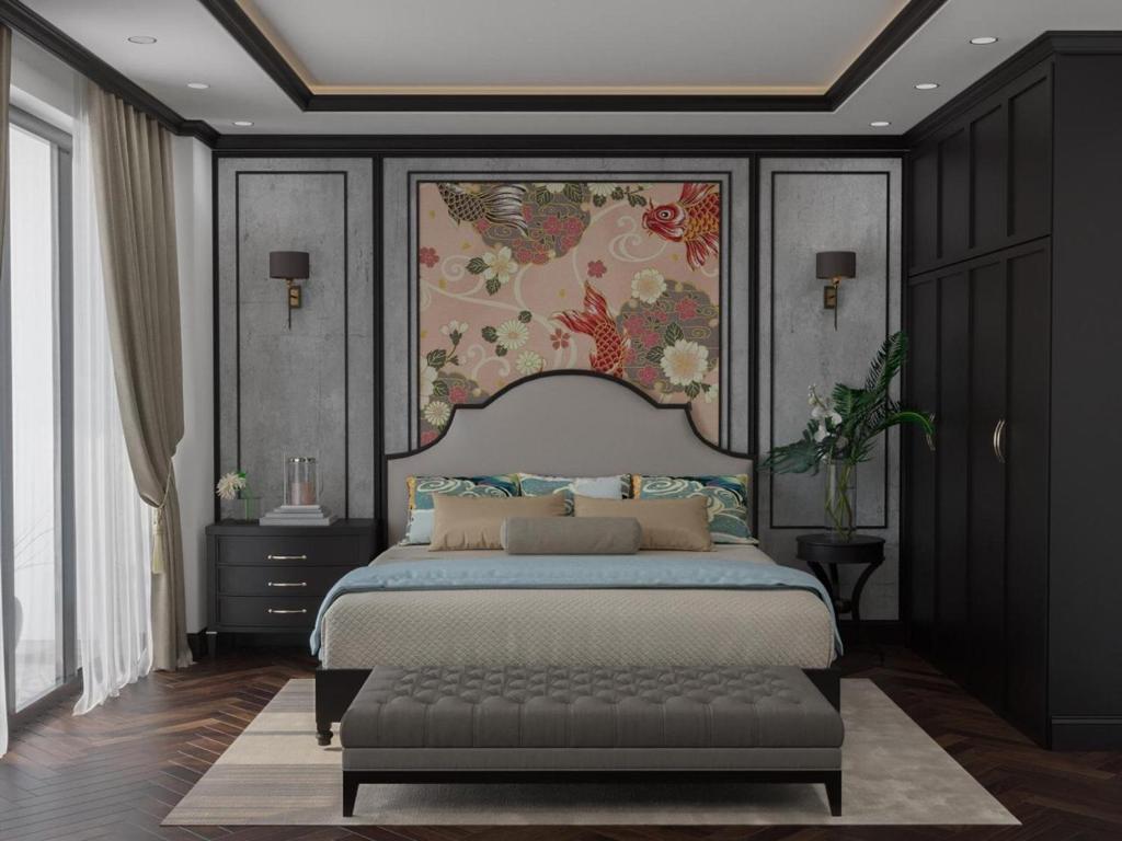 a bedroom with a large bed and a painting on the wall at Charming Moon Hotel in Hanoi