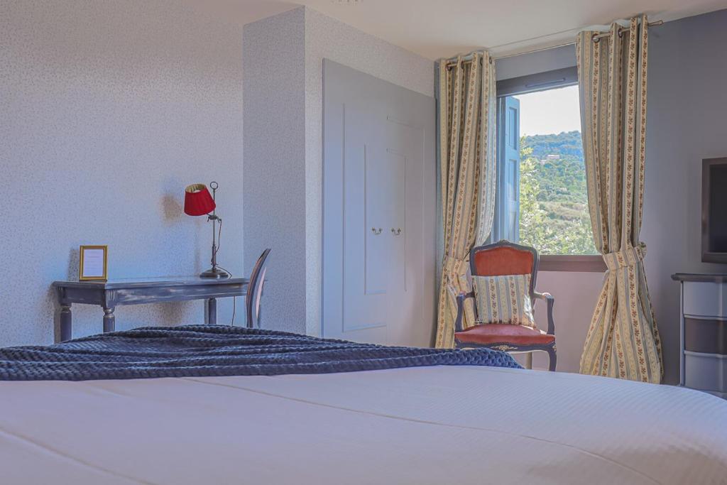 Postel nebo postele na pokoji v ubytování Le Relais Des Chartreuses