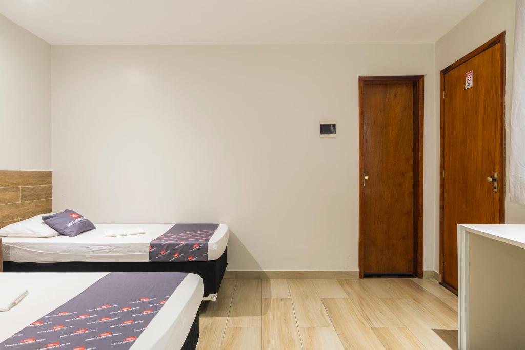 Postel nebo postele na pokoji v ubytování Mega Aeroporto Hotel Apenas 1 km de distância do Aeroporto de Fortaleza