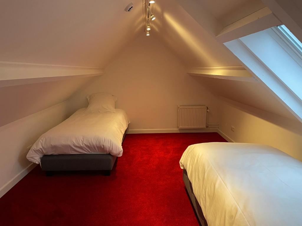 Postel nebo postele na pokoji v ubytování B&B Het Doctershoes