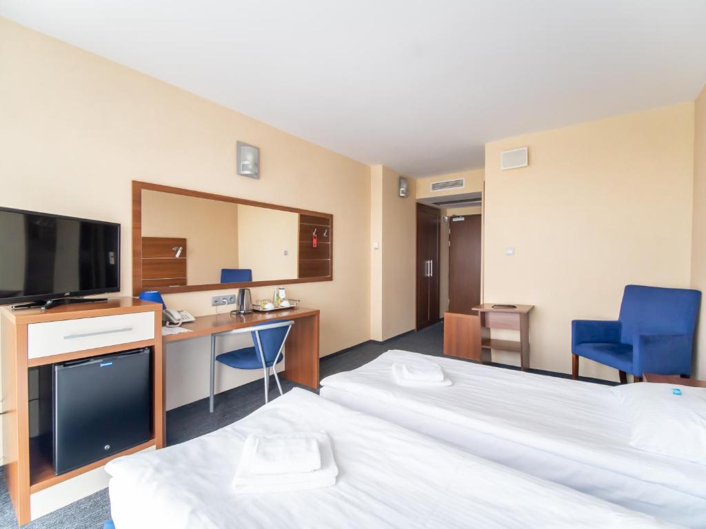 Postel nebo postele na pokoji v ubytování Hotel Tychy Prime