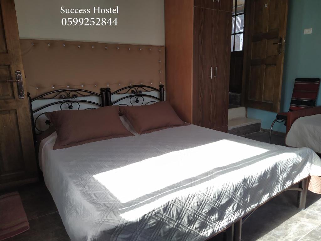 Postel nebo postele na pokoji v ubytování Success Hostel