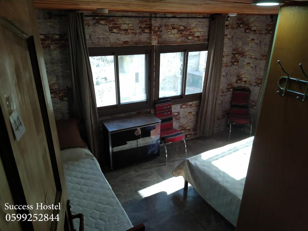 Postel nebo postele na pokoji v ubytování Success Hostel