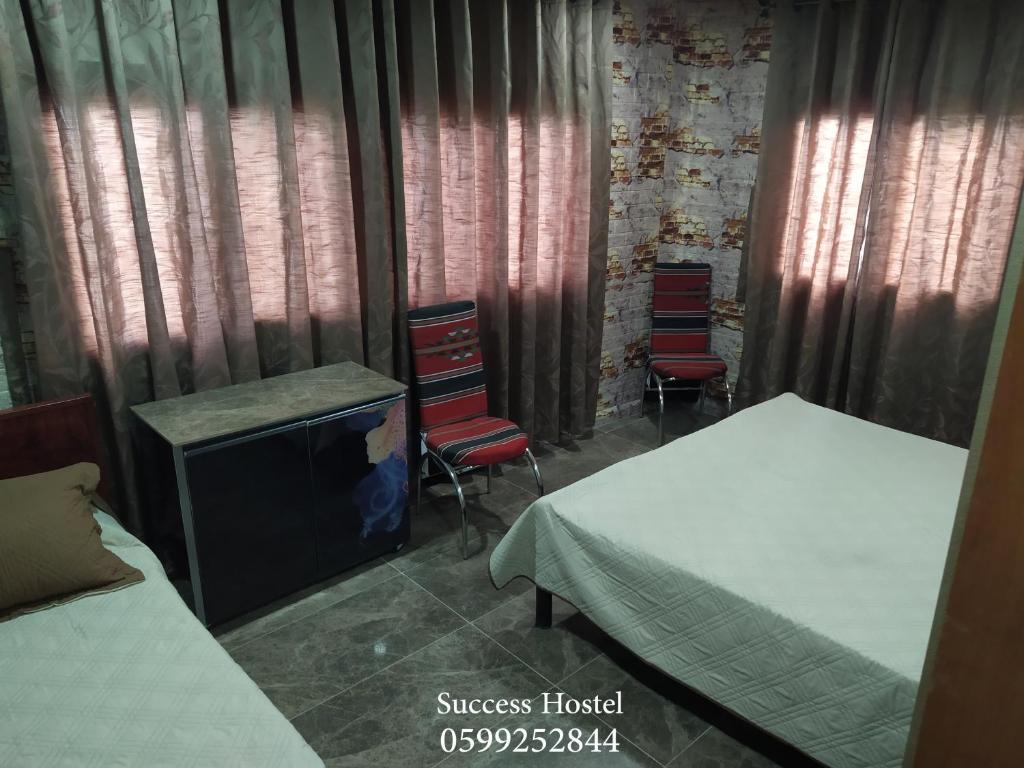 Postel nebo postele na pokoji v ubytování Success Hostel